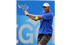 EASTBOURNE, ENGLAND - JUNE 14: Chris Guccione of Australia plays a backhand against Scott Clayton of Great Britain during their Men's Singles qualifying match on day one of the Aegon International at Devonshire Park on June 14, 2014 in Eastbourne, England.  (Photo by Steve Bardens/Getty Images)